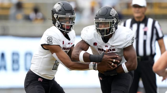 Sep 10, 2022; Berkeley, California, USA; UNLV Rebels quarterback Doug Brumfield (2) hands off to running back Aidan Robbins (9) during the third quarter against the California Golden Bears at FTX Field at California Memorial Stadium.